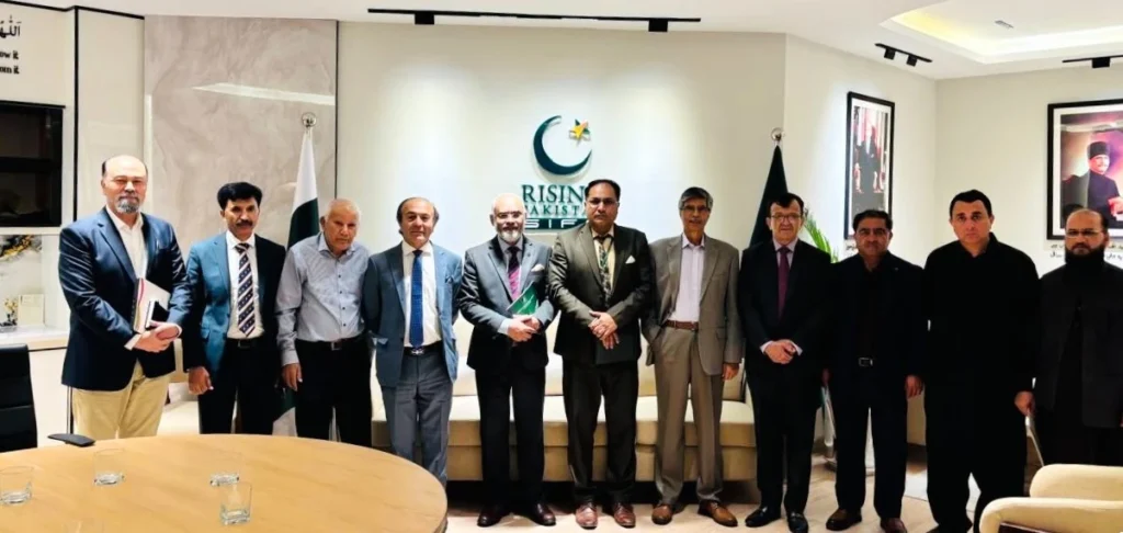 Current image: Senior government officials pose for a group photo during a high-level meeting at the Prime Minister's House in Islamabad under the SIFC framework