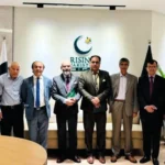 Senior government officials pose for a group photo during a high-level meeting at the Prime Minister's House in Islamabad under the SIFC framework